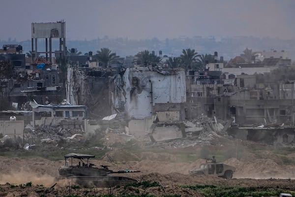 FILE - Israeli soldiers operate inside the Gaza Strip, as seen from southern Israel, Feb. 13, 2024. (AP Photo/Ariel Schalit, File)