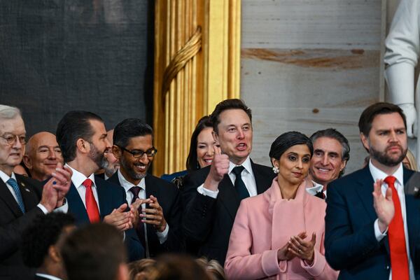 Jeff Bezos, from second left, Donald Trump Jr., Sundar Pichai, Elon Musk, Usha Vance, Doug Burgum and Vice President JD Vance applaud during the 60th Presidential Inauguration in the Rotunda of the U.S. Capitol in Washington, Monday, Jan. 20, 2025. (Kenny Holston/The New York Times via AP, Pool)