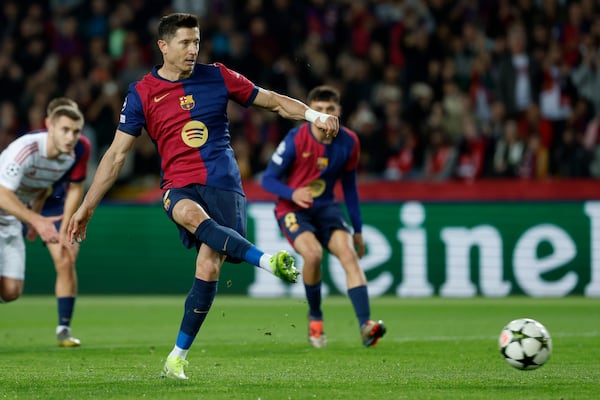 Barcelona's Robert Lewandowski shoots from the penalty spot to score his team's first goal during a Champions League phase soccer Matchday 5 between Barcelona and Brest at the Lluis Companys Olympic Stadium in Barcelona, Spain, Tuesday, Nov. 26, 2024. (AP Photo/Joan Monfort)