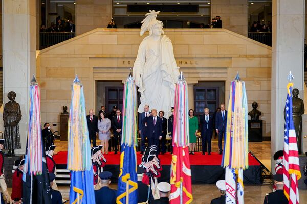 President Donald Trump salutes while on stage in Emancipation Hall at the 60th Presidential Inauguration, Monday, Jan. 20, 2025, at the U.S. Capitol in Washington. (Al Drago/Pool Photo via AP)