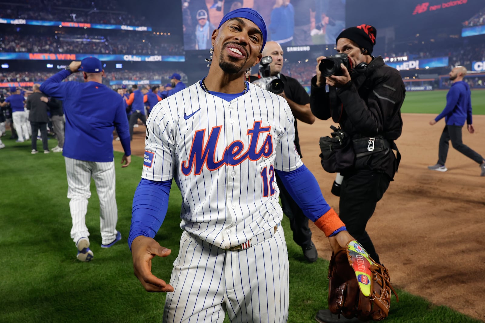 New York Mets shortstop Francisco Lindor (12) celebrates after the New York Mets beat the Philadelphia Phillies in Game 4 of the National League baseball playoff series, Wednesday, Oct. 9, 2024, in New York. (AP Photo/Adam Hunger)