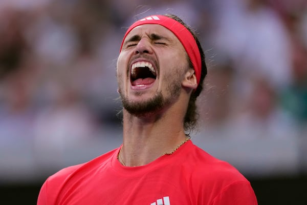 Alexander Zverev of Germany celebrates a point during his fourth round match against Ugo Humbert of France at the Australian Open tennis championship in Melbourne, Australia, Sunday, Jan. 19, 2025. (AP Photo/Vincent Thian)