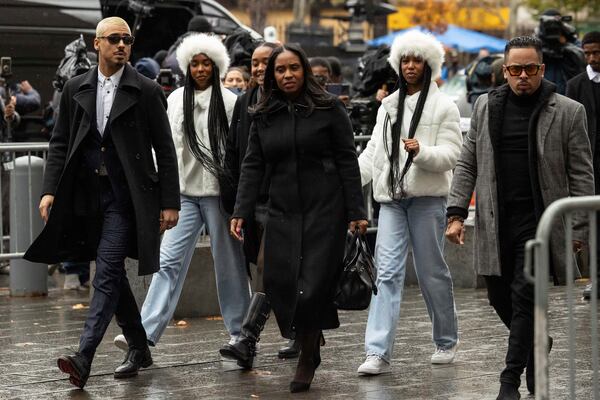 Quincy Brown, left, stepson of Sean "Diddy Combs and other family members arrive at Manhattan federal court, Friday, Nov. 22 2024, in New York. (AP Photo/Yuki Iwamura)