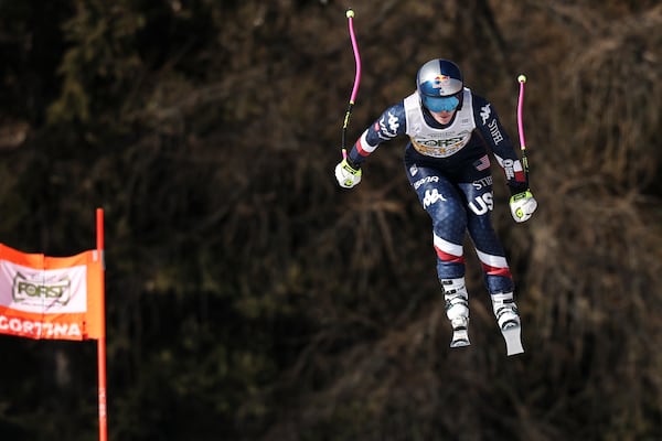 United States' Lindsey Vonn speeds down the course during an alpine ski, women's World Cup downhill training, in Cortina d'Ampezzo, Italy, Thursday, Jan. 16, 2025. (AP Photo/Marco Trovati)