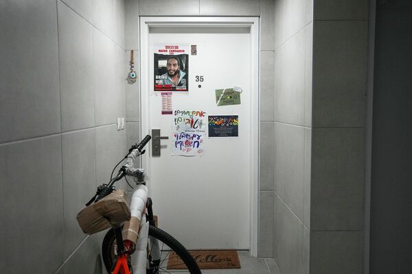 A photo of Matan Zangauker, a hostage taken by Hamas, is displayed in the apartment of his girlfriend, released hostage Ilana Gritzewsky, in Kiryat Gat, Israel, Sunday, Dec. 15, 2024. (AP Photo/Tsafrir Abayov)