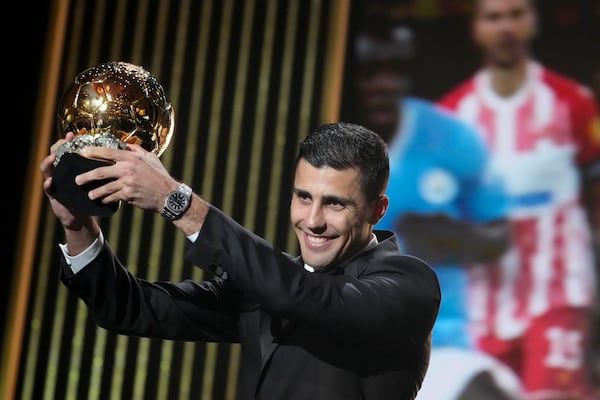 FILE - Manchester City's Spanish player Rodri receives the 2024 Men's Ballon d'Or award during the 68th Ballon d'Or (Golden Ball) award ceremony at Theatre du Chatelet in Paris, Monday, Oct. 28, 2024. (AP Photo/Michel Euler, File)