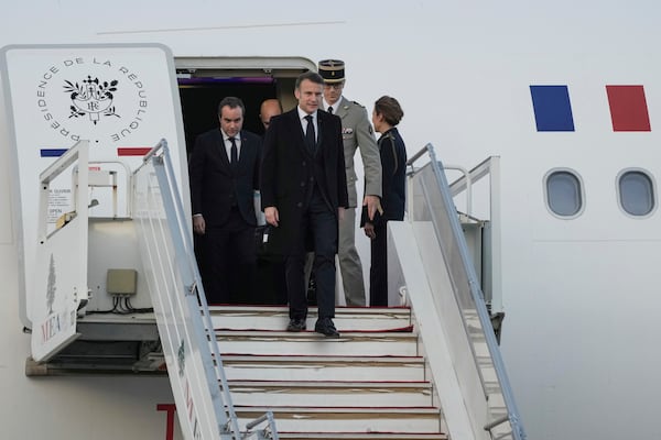 French President Emmanuel Macron gets off from his plane as he arrives at Beirut's Rafik Hariri International Airport in Beirut, Lebanon, Friday, Jan. 17, 2025. (AP Photo/Hassan Ammar)