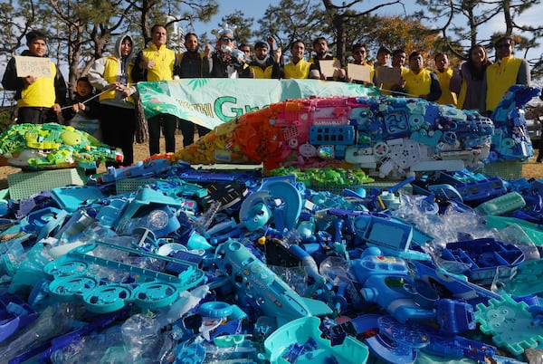 Environment activists stage a rally calling for a strong global plastics treaty ahead of the fifth session of the Intergovernmental Negotiating Committee on Plastic Pollution which sets to be held from Nov. 25 to Dec. 1 in Busan, South Korea, Saturday, Nov. 23, 2024. (Son Hyung-joo/Yonhap via AP)