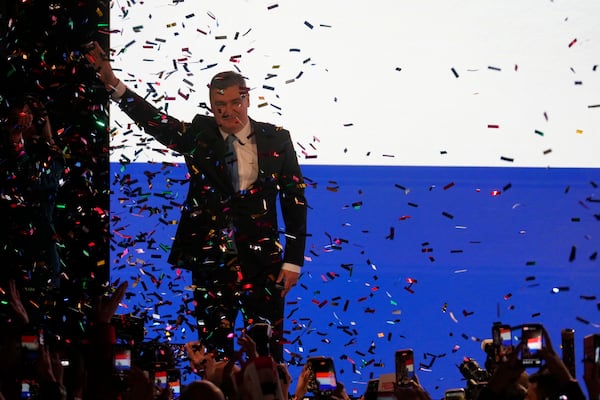 President incumbent Zoran Milanovic greets his supporters as the preliminary results grant him victory in a runoff vote for the Croatian presidential election in Zagreb, Croatia, Sunday, Jan. 12, 2025. (AP Photo/Darko Bandic)