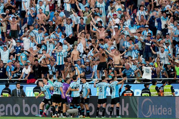 Players of Argentina's Racing Club celebrates after Roger Martinez scored his side's third goal against Brazil's Cruzeiro during the Copa Sudamericana final soccer match in Asuncion, Paraguay, Saturday, Nov. 23, 2024. (AP Photo/Jorge Saenz)