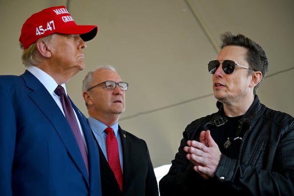 President-elect Donald Trump speaks with Elon Musk as Sen. Kevin Cramer, R-N.D., listens before attending a viewing of the launch of the sixth test flight of the SpaceX Starship rocket Tuesday, Nov. 19, 2024 in Brownsville, Texas. (Brandon Bell/Pool via AP)