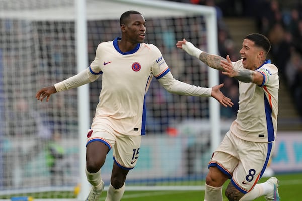 Chelsea's Nicolas Jackson, left, celebrates after scoring the opening goal during the English Premier League soccer match between Leicester City and Chelsea at King Power stadium in Leicester, England, Saturday, Nov. 23, 2024. (AP Photo/Dave Shopland)