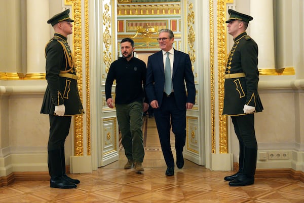 British Prime Minister Keir Starmer, center right and Ukrainian President Volodymyr Zelenskyy arrive for their bilateral talks aat Mariinskyi Palace, in Kyiv, Ukraine Thursday, Jan. 16, 2025. (Carl Court/Pool Photo via AP)