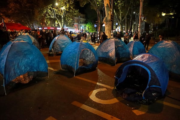 Protesters' tents are seen in a street during a rally against the results of the parliamentary elections amid allegations that the vote was rigged in Tbilisi, Georgia, early Monday, Nov. 18, 2024. (AP Photo/Zurab Tsertsvadze)