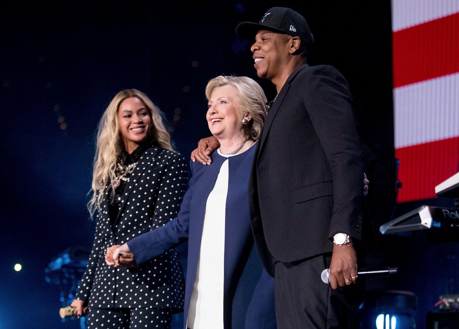 FILE - Democratic presidential candidate Hillary Clinton, center, appears on stage with artists Jay Z, right, and Beyonce during a free concert at the Wolstein Center in Cleveland, Nov. 4, 2016. (AP Photo/Andrew Harnik, File)