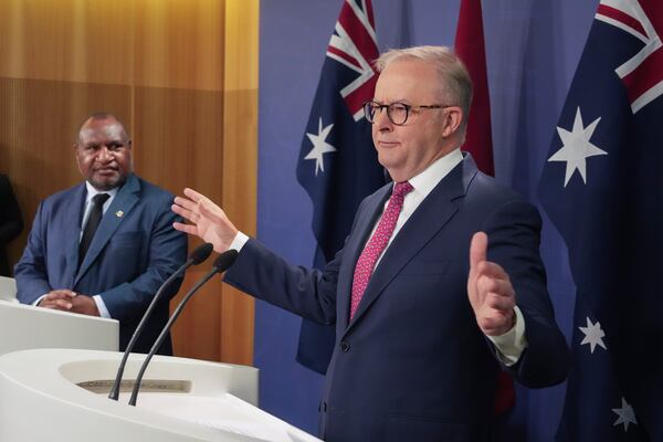 Australian Prime Minister Anthony Albanese, right, gestures during a press conference with Papua New Guinea Prime Minister James Marape in Sydney, Australia, Thursday, Dec. 12, 2024. (AP Photo/Mark Baker)