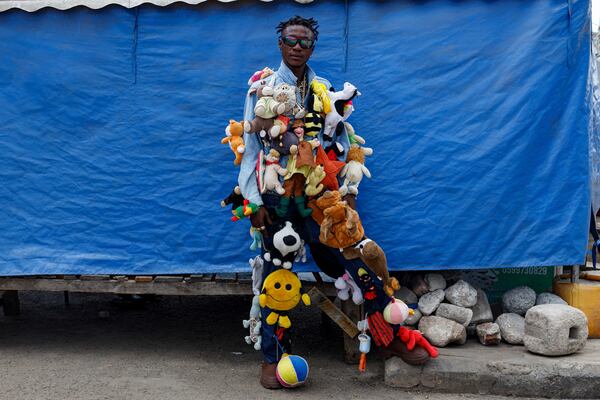 An upcycle designer poses for a photograph during a thrift and an upcycle show in Accra, Ghana, Sunday, Oct. 27, 2024. (AP Photo/Misper Apawu)