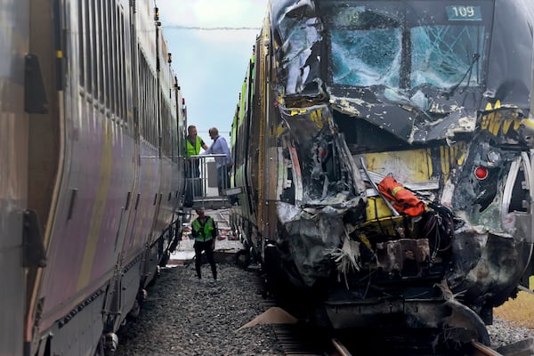 A damaged Brightline train is seen after it collided with a fire truck in downtown Delray Beach, Fla., Saturday, Dec. 28, 2024. (Mike Stocker/South Florida Sun-Sentinel via AP)