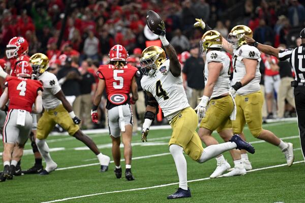 Notre Dame linebacker Jaiden Ausberry (4) celebrates after recovering a fumble during the first half against Georgia in the quarterfinals of a College Football Playoff, Thursday, Jan. 2, 2025, in New Orleans. (AP Photo/Matthew Hinton)