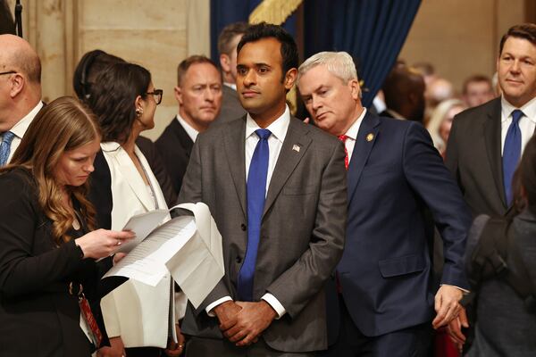 Vivek Ramaswamy, center, arrives before the 60th Presidential Inauguration in the Rotunda of the U.S. Capitol in Washington, Monday, Jan. 20, 2025. (Chip Somodevilla/Pool Photo via AP)