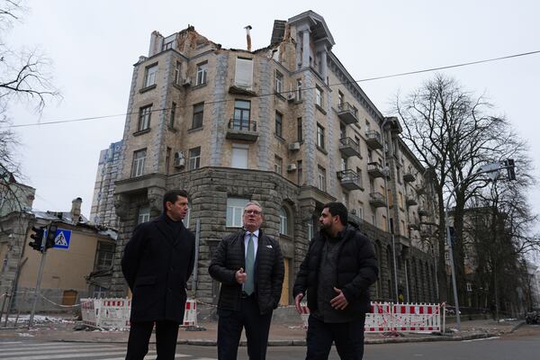 British Prime Minister Keir Starmer stands in front of a damaged building ahead of talks with Ukrainian President Volodymyr Zelenskyy, in Kyiv, Ukraine Thursday, Jan. 16, 2025. (Carl Court/Pool Photo via AP)