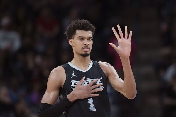 San Antonio Spurs center Victor Wembanyama calls a play during the first half of an NBA basketball game against the LA Clippers in San Antonio, Wednesday, Jan. 29, 2025. (AP Photo/Eric Gay)