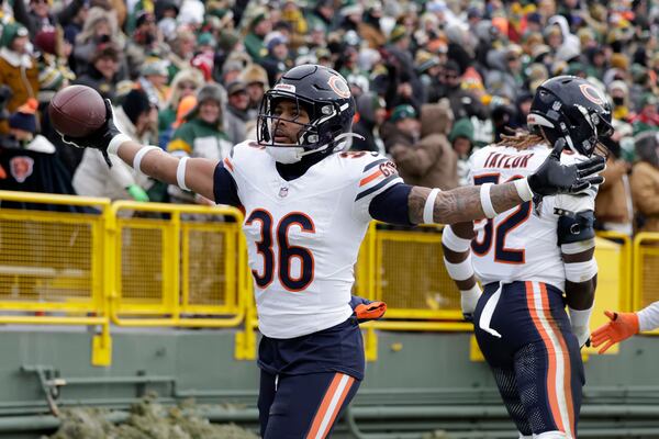 Chicago Bears safety Jonathan Owens (36) celebrates after recovering a fumble against the Green Bay Packers during the first half of an NFL football game, Sunday, Jan. 5, 2025, in Green Bay, Wis. (AP Photo/Matt Ludtke)