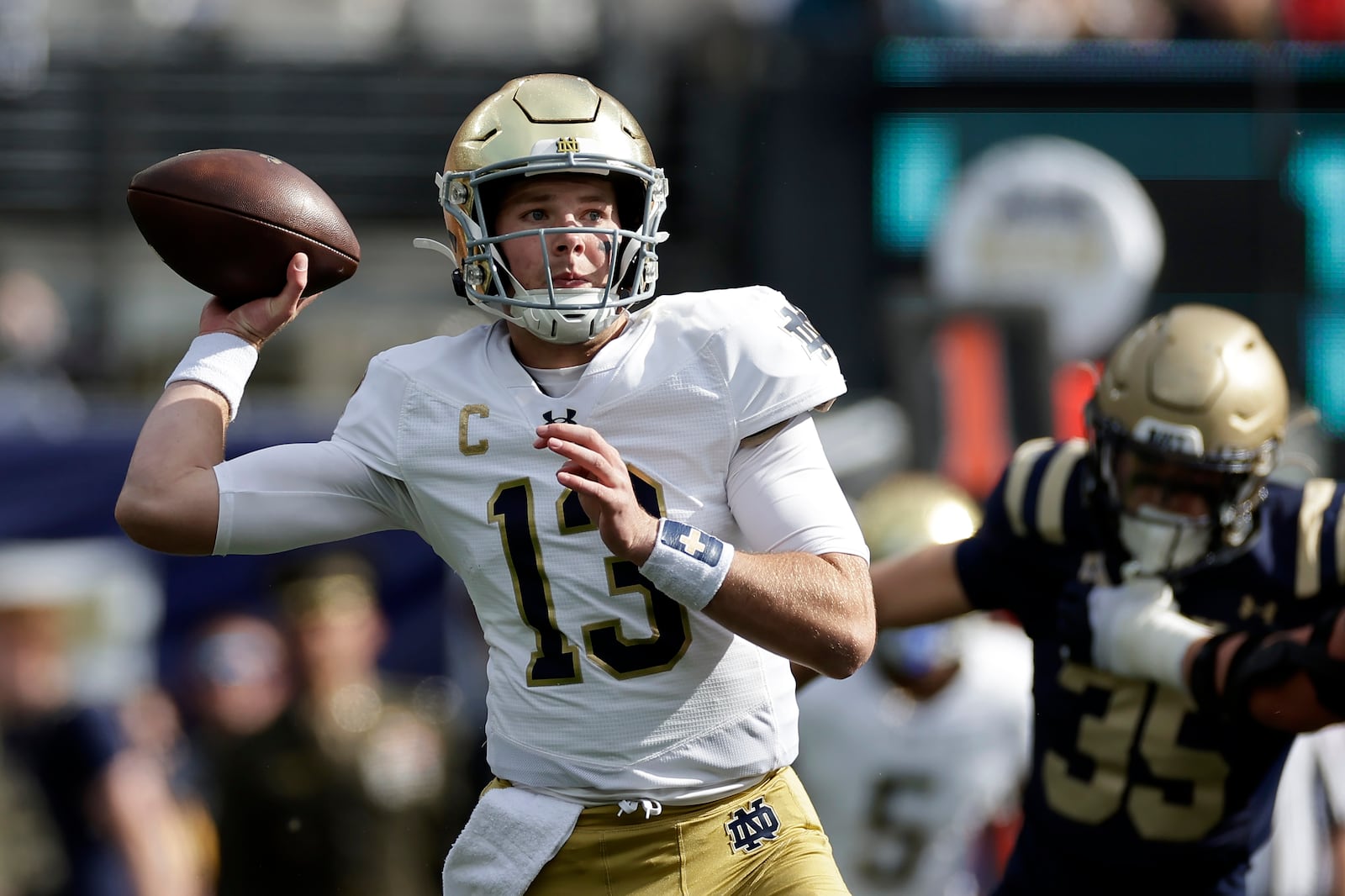 Notre Dame quarterback Riley Leonard (13) throws a pass during the first half of an NCAA college football game against Navy, Saturday, Oct. 26, 2024, in East Rutherford, N.J. (AP Photo/Adam Hunger)