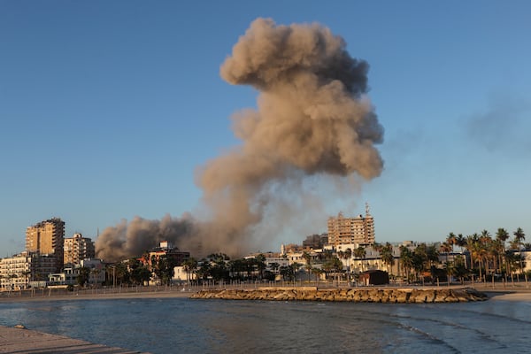 Smoke rises from a building hit in an Israeli airstrike in Tyre, southern Lebanon, Saturday, Nov. 16, 2024. (AP Photo/Mohammed Zaatari)