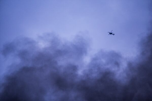 FILE - American attack helicopter flies over Hassakeh, Syria, on Jan. 24, 2022. (AP Photo/Baderkhan Ahmad, File)