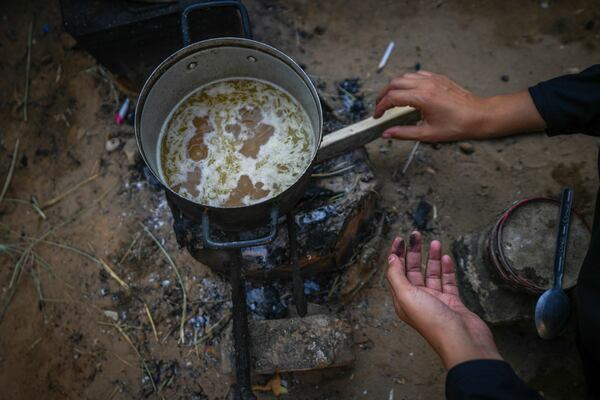 Alaa Hamami prepares noodles in her tent at a camp for displaced Palestinians in Deir al-Balah, Gaza Strip, Nov. 9, 2024. (AP Photo/Abdel Kareem Hana)