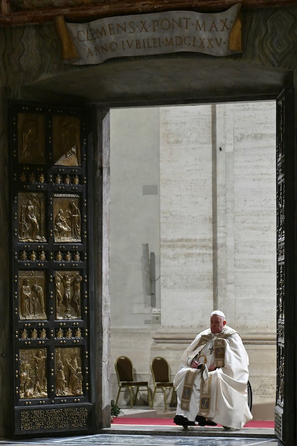 Pope Francis opens the Holy Door of St Peter's Basilica to mark the start of the Catholic Jubilee Year, at the Vatican, Dec. 24, 2024. (Alberto Pizzoli/Pool Photo via AP)