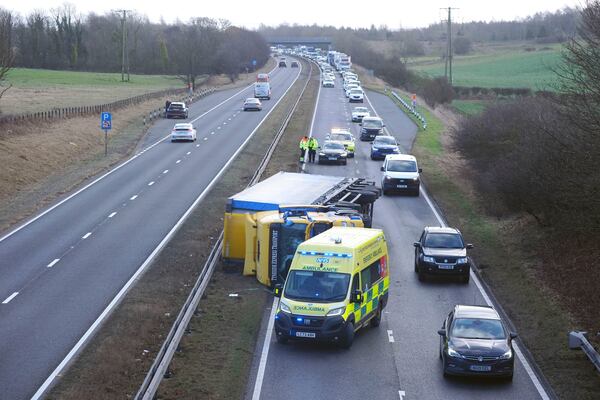 An ambulance attends the scene of a crash during strong winds on the north bound A19 near to the A690 Durham Road, in County Durham, in the North East of England, Friday Jan. 24, 2025, as Storm Eowyn hits the country. (Owen Humphreys/PA via AP)