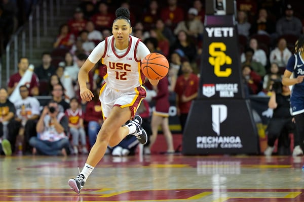 Southern California guard JuJu Watkins takes the ball downcourt during the second half of an NCAA college basketball game against Penn State, Jan. 12, 2025, in Los Angeles. (AP Photo/Jayne Kamin-Oncea)