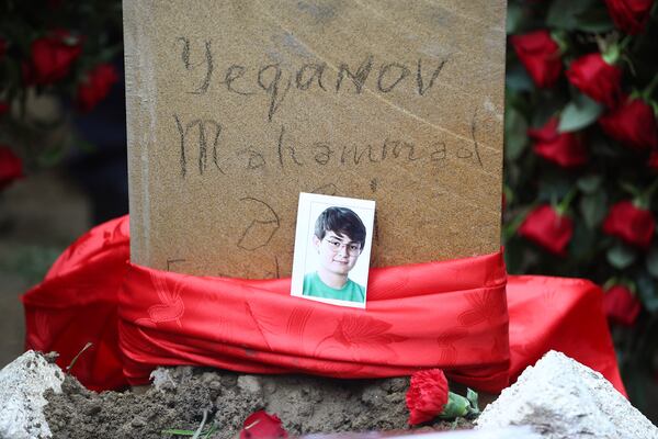 The tomb of Mahammadali Eganov, 13 who died in the Azerbaijan Airlines Embraer 190 crash near Kazakhstan's Aktau airport, in Baku, Azerbaijan, Saturday, Dec. 28, 2024. (AP Photo)