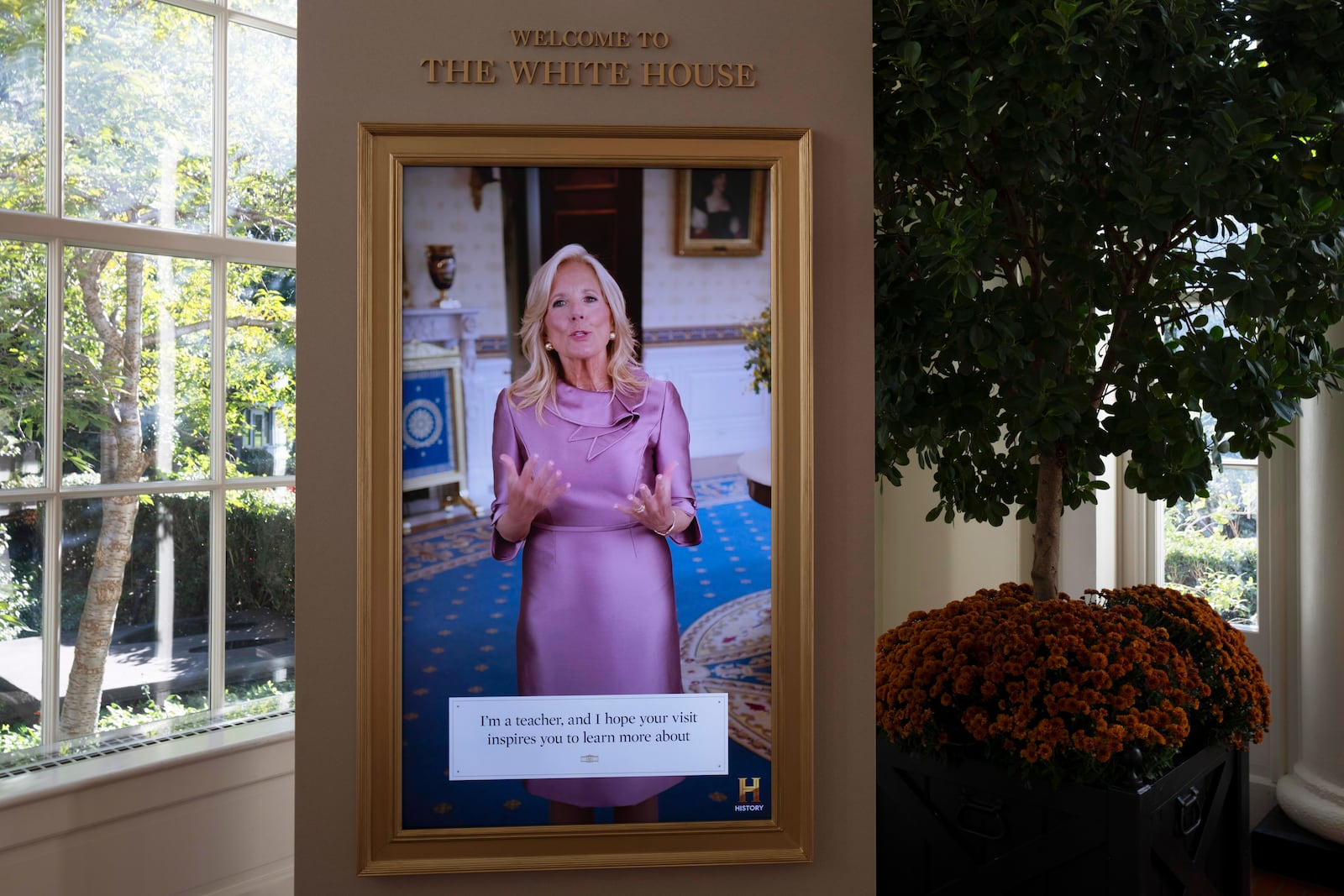 A video of first lady Jill Biden welcoming visitors to the White House Public Tour is shown on Friday, Oct. 18, 2024 in the Booksellers Hall at the entry area to the tour. First lady Jill Biden is unveiling the updated tour on Monday, Oct. 21, 2024. (AP Photo/Manuel Balce Ceneta)