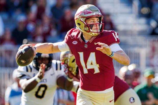 Florida State quarterback Luke Kromenhoek (14) throws a pass during the first half of an NCAA college football game against Charleston Southern, Saturday, Nov. 23, 2024, in Tallahassee, Fla. (AP Photo/Colin Hackley)