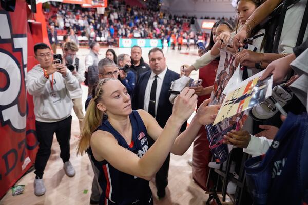 UConn's Paige Bueckers (5) signs autographs after an NCAA women's college basketball game against St. John's, Wednesday, Jan. 15, 2025, in New York. (AP Photo/Frank Franklin II)