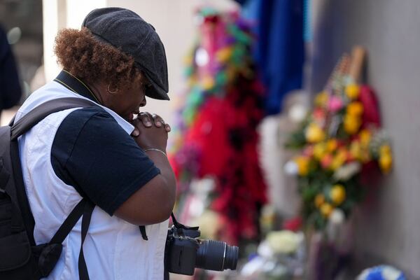 Shawn Westbrook prays at a memorial to the victims of a deadly truck attack on Bourbon Street in the French Quarter, Friday, Jan. 3, 2025, in New Orleans. (AP Photo/George Walker IV)