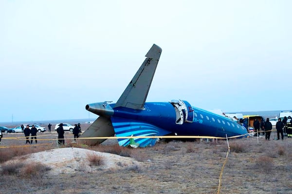 In this photo taken from a video released by the administration of Mangystau region, a part of Azerbaijan Airlines' Embraer 190 lies on the ground near the airport of Aktau, Kazakhstan, on Thursday, Dec. 26, 2024. (The Administration of Mangystau Region via AP)