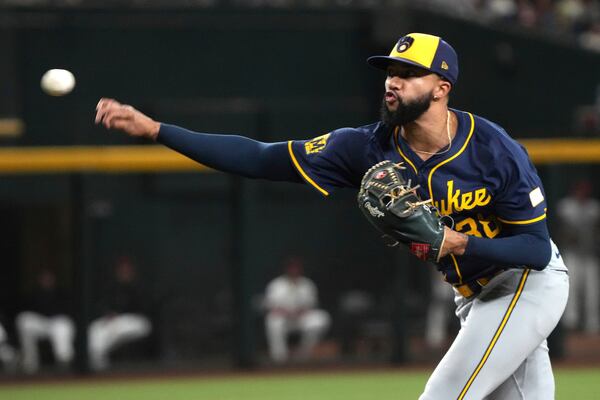 FILE - Milwaukee Brewers pitcher Devin Williams throws against the Arizona Diamondbacks in the ninth inning during a baseball game, Friday, Sept. 13, 2024, in Phoenix. (AP Photo/Rick Scuteri, File)