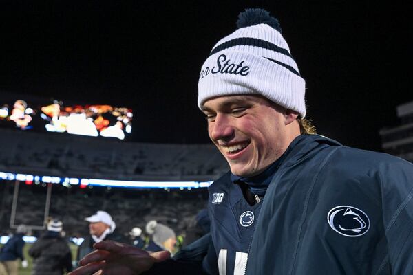 FILE - Penn State quarterback Drew Allar celebrates following a victory over Maryland in an NCAA college football game, Saturday, Nov. 30, 2024, in State College, Pa. (AP Photo/Barry Reeger, File)