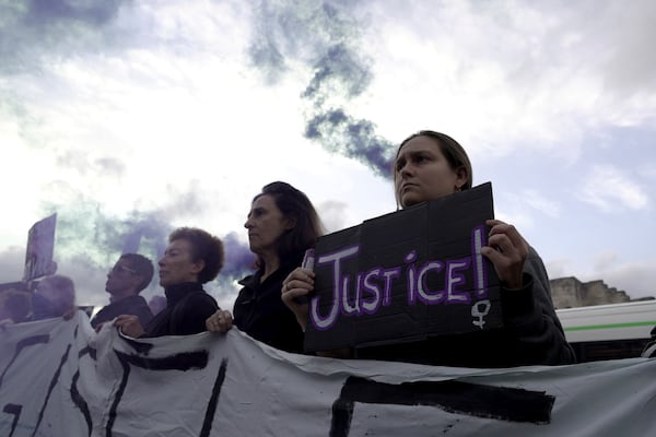 Women demonstrate to mark the International Day for the Elimination of Violence against Women, as the trial of dozens of men accused of raping Gisele Pelicot while she was drugged and rendered unconscious by her husband goes on, Monday, Nov. 25, 2024 in Avignon, southern France. (AP Photo/John Leicester)