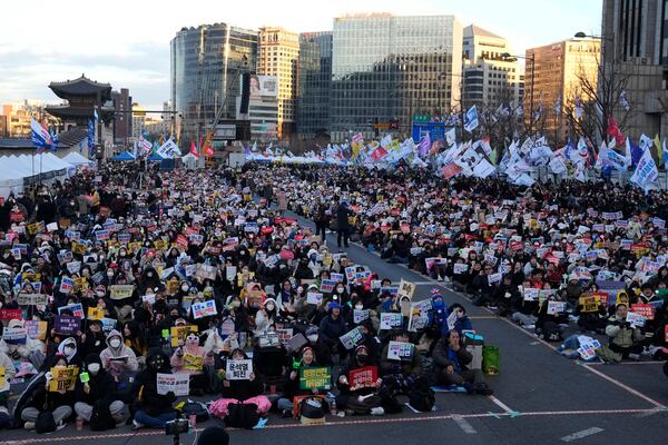 Protesters stage a rally demanding immediate indictment of impeached South Korean President Yoon Suk Yeol in Seoul, South Korea, Saturday, Jan. 25, 2025. (AP Photo/Ahn Young-joon)