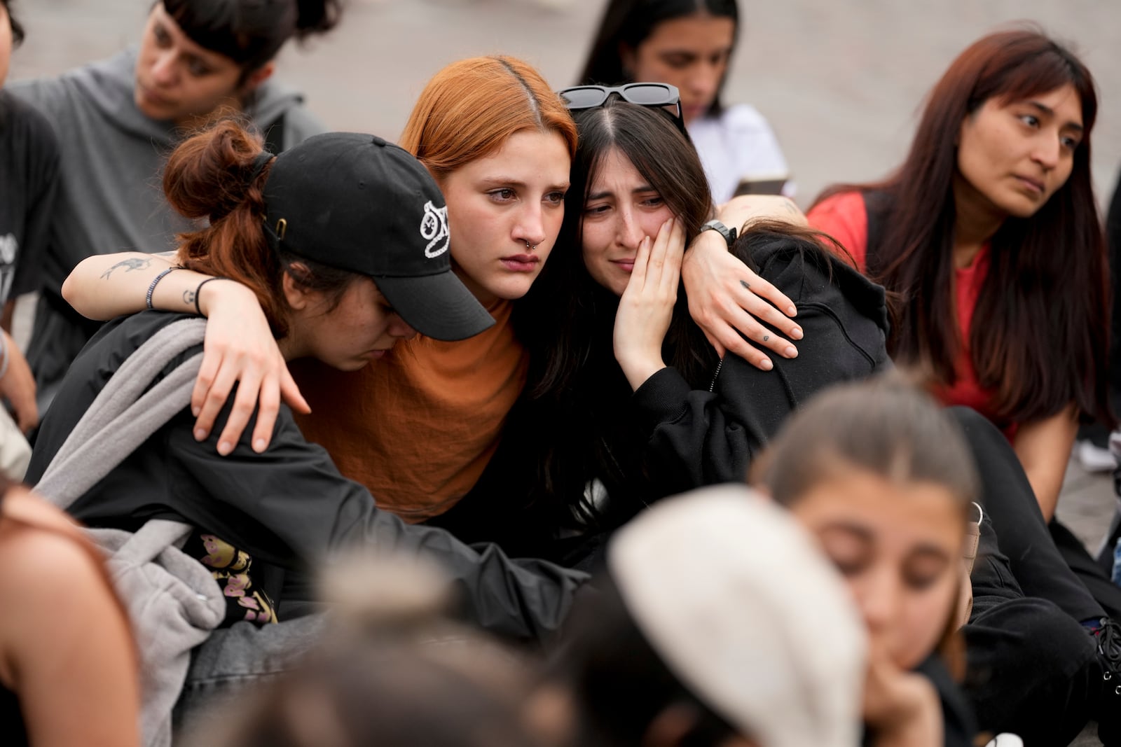 Fans of former One Direction singer Liam Payne gather at the Obelisk to honor him one day after he was found dead at a hotel in Buenos Aires, Argentina, Thursday, Oct. 17, 2024. (AP Photo/Natacha Pisarenko)