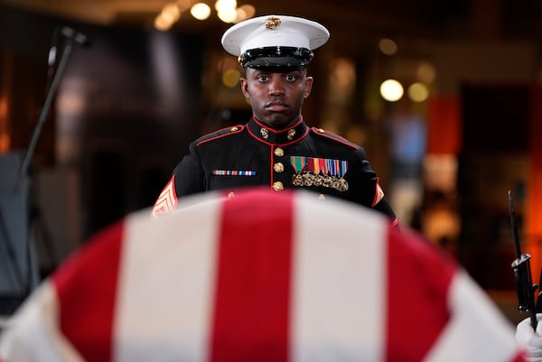 Marine Staff Sgt. Nayya Dobson-EL stands as part of the Guard of Honor at the flag-draped casket of former President Jimmy Carter as he lies in repose at the Jimmy Carter Presidential Library and Museum in Atlanta, Saturday, Jan. 4, 2025. Carter died Dec. 29 at the age of 100. (AP Photo/Alex Brandon, Pool)