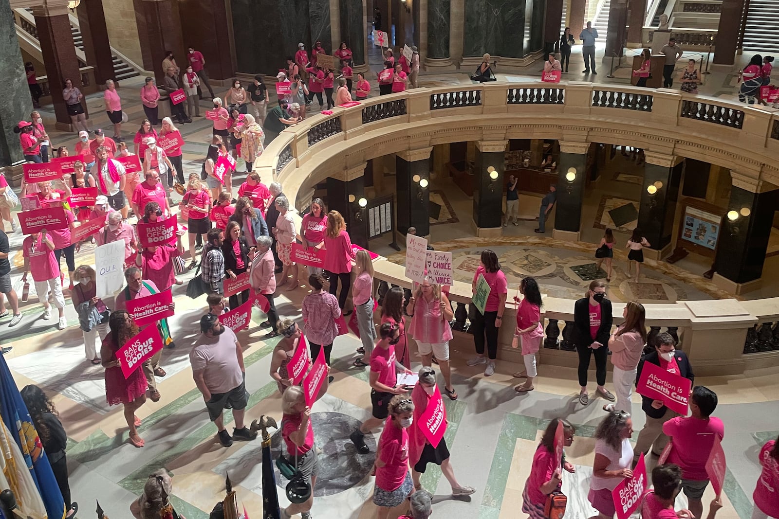 FILE - Abortion rights supporters gather for a "pink out" protest organized by Planned Parenthood in the rotunda of the Wisconsin Capitol, June 22, 2022, in Madison, Wis. (AP Photo/Harm Venhuizen, File)