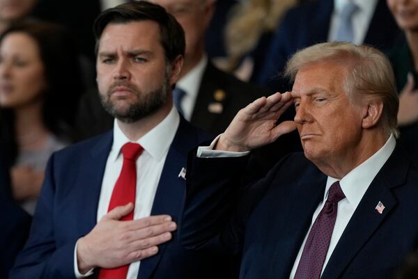 President Donald Trump and Vice President JD Vance listen to Christopher Macchio sing during the 60th Presidential Inauguration in the Rotunda of the U.S. Capitol in Washington, Monday, Jan. 20, 2025. (AP Photo/Julia Demaree Nikhinson, Pool)