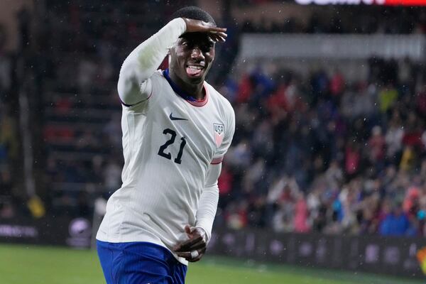 United States' Tim Weah (21) celebrates after scoring during the second half in a CONCACAF Nations League quarterfinal second leg soccer match against Jamaica Monday, Nov. 18, 2024, in St. Louis. (AP Photo/Jeff Roberson)