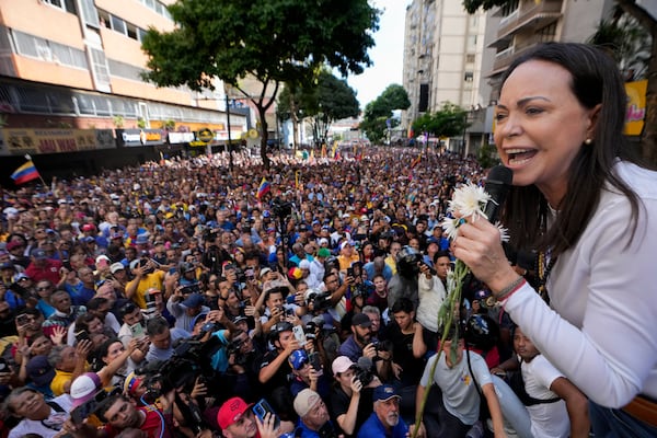 Opposition leader Maria Corina Machado addresses supporters during a protest against President Nicolas Maduro the day before his inauguration for a third term in Caracas, Venezuela, Thursday, Jan. 9, 2025. (AP Photo/Matias Delacroix)